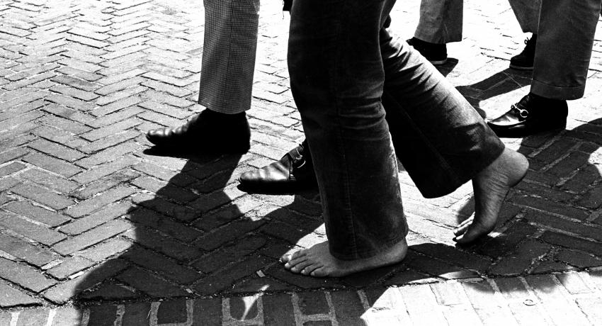 Photograph of pedestrians' bare feet in front of Clark Hall, 1970